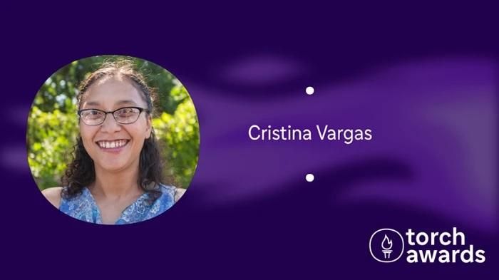 headshot of Cristina Vargas on a variegated purple background and the torch awards logo in the lower right corner.