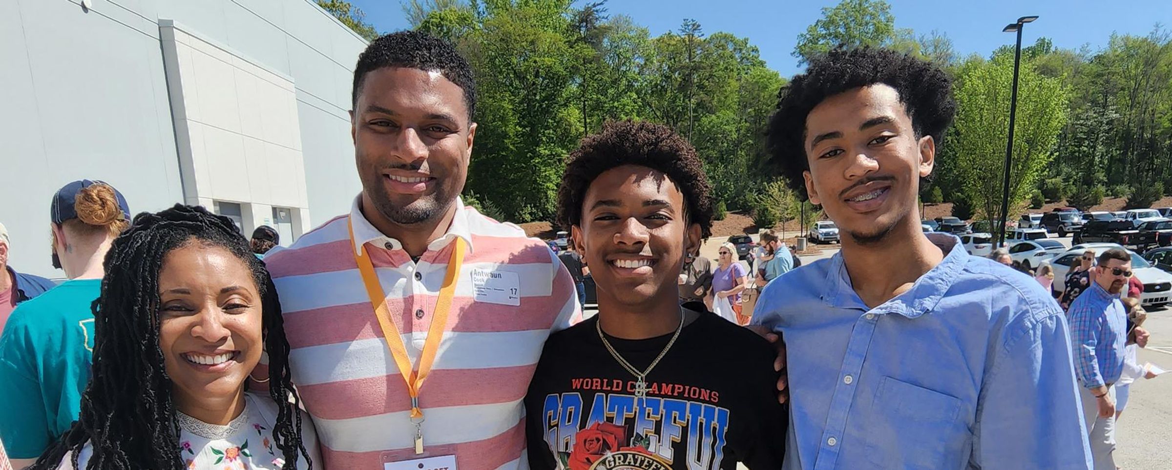 Antwaun Cook stands with his arms around his wife and two sons.