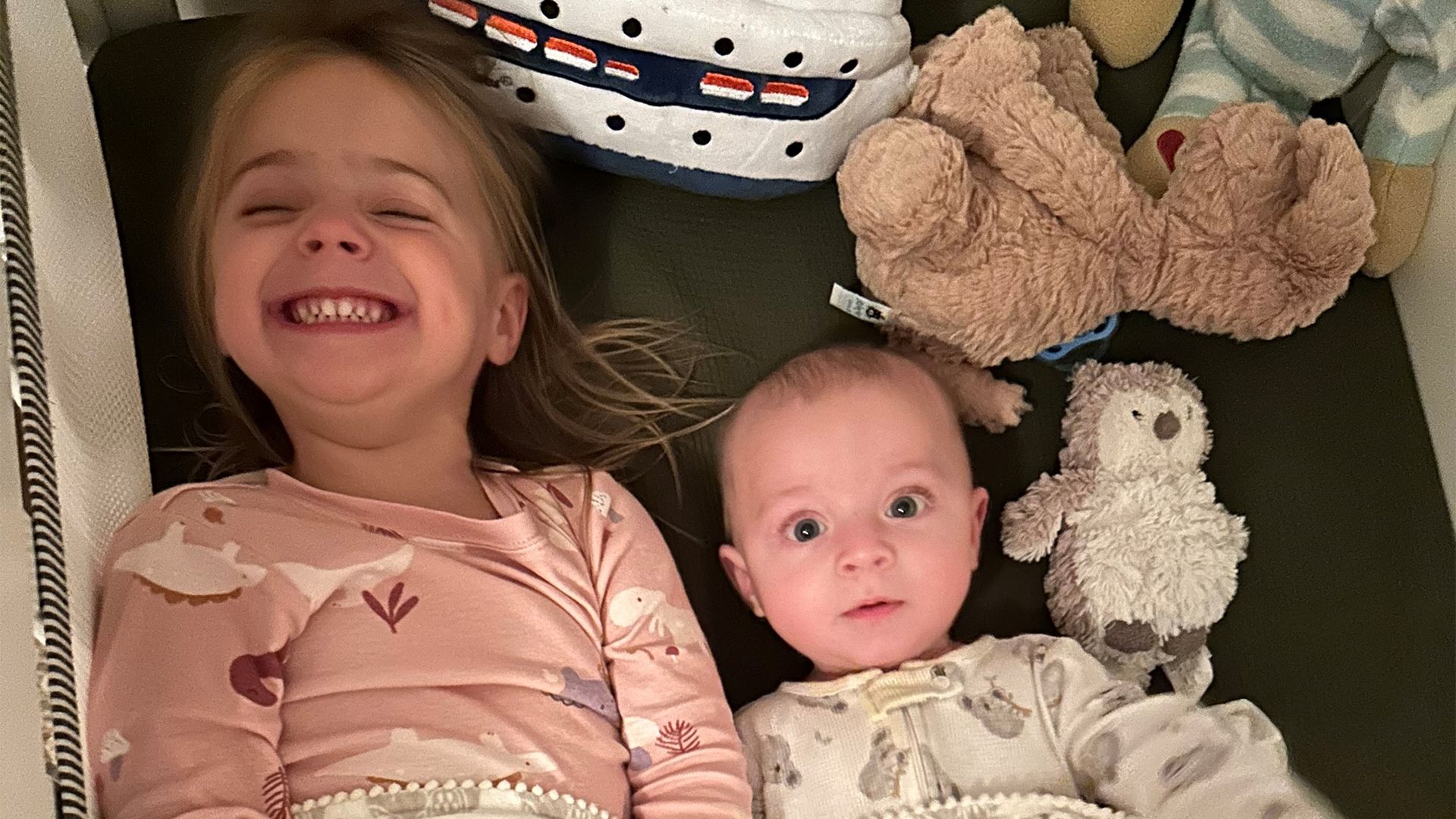 Two children smiling.