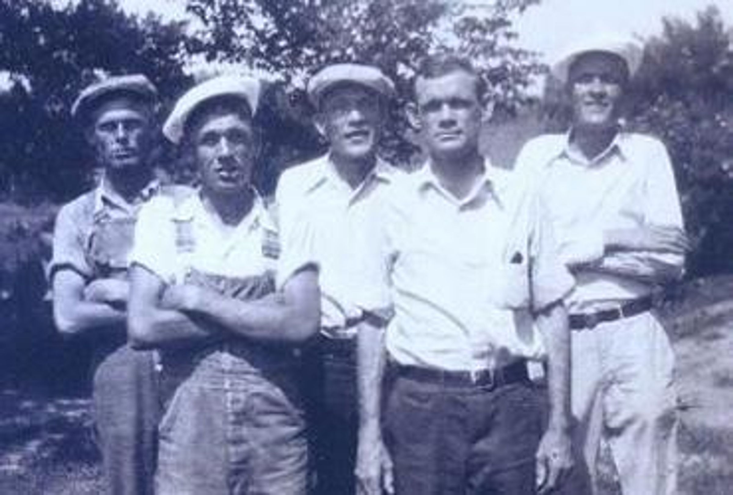 Jack Johnson's maternal grandfather stands with his four brothers in a line in a black and white photo from 1938.