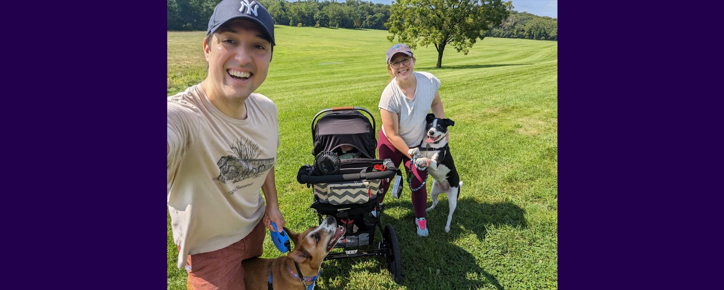 Jon Florio, his wife Meg, their daugther in a stroller and two dogs on a grassy background while out for a walk.